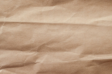 Crumpled paper with wrinkles, ecological or craft paper, surface texture close-up