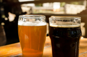 pint of lager and pint of stout. Craft beer