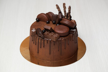 Chocolate cake with chocolate decoration, chocolate ganache