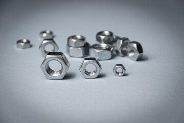 Big and small screw-nut. Concept. White background.