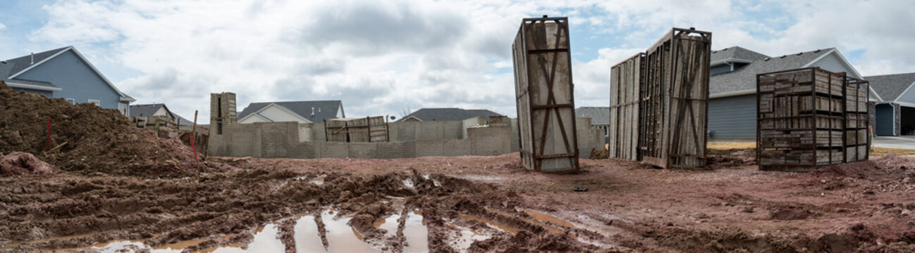 Residential House Construction Under Rain Delay With Mud And Tracks