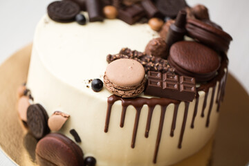Chocolate cake for men with chocolate decorations and the streaks of chocolate