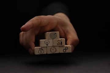 Concept of business strategy and action plan. Wood cube block stacking with icon