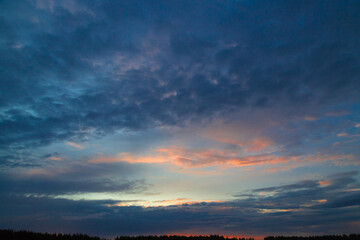Fototapeta na wymiar Panorama of the sky with beautiful colored whimsical clouds