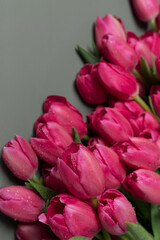 greeting card with beautiful red tulip flowers on a marble background. Spring summer holidays celebration