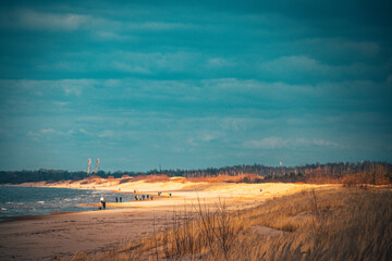 Sea coast with silhouttes on sand Jurmala