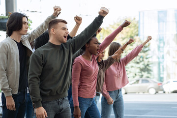 Side view of protestors striking against racism on the street