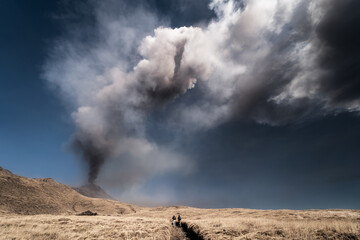 Spectacular eruption of the Etna volcano with column of smoke in the sky
