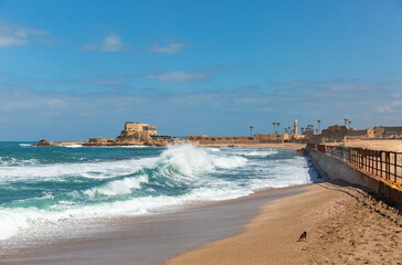 Sea with waves near the coast of the old city in Caesarea