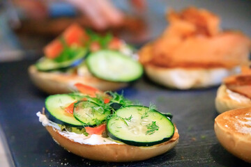 Salmon cucumber cream cheese on a bagel sandwich