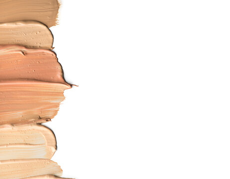Foundation smuges, face make-up samples. Set of cosmetic liquid foundation or cream in different colour smudge smear strokes. Make up smears isolated on a white background. Foundation colors palette. 