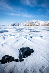 Fototapeta na wymiar Snow-covered ice of Lake Baikal