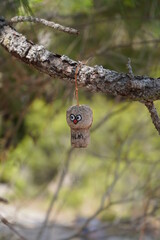 Painted cork hanging on a tree. 