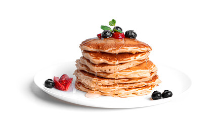 Pancakes with berries isolated on a white background.