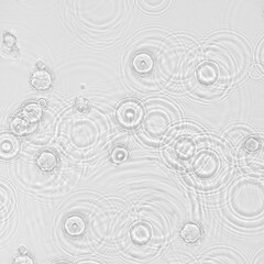 Water background. White water texture, blue mint water surface with rings and ripple. Spa concept background. Flat lay, top view, copy space, square composition with copy-space.