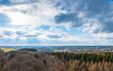 Fototapeta na wymiar Aerial view over forests and meadows of Westerwald, Altenkirchen, Germany