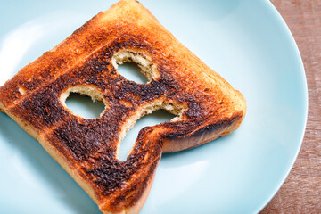 Burnt toast and Sad Face - obrazy, fototapety, plakaty