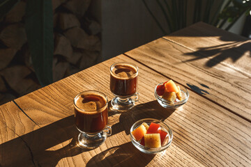 Coffee and sweets on a wooden table