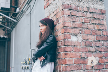 young asiatic woman posing cranky