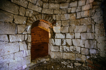 Fototapeta na wymiar Abandoned empty old underground round cellar under rural house