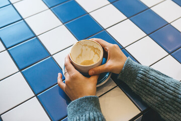 A cup of drunk coffee in the hands