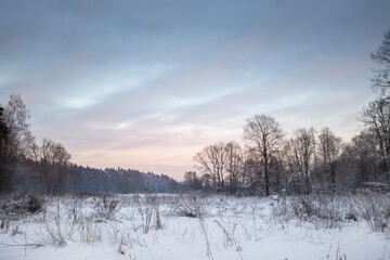 Beautiful snowy winter landscape panorama with sun.