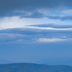Clouds above carpathian mountains in evening 