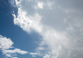 rain and sun , blue sky with clouds