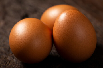 Brown chicken eggs rises on the table.