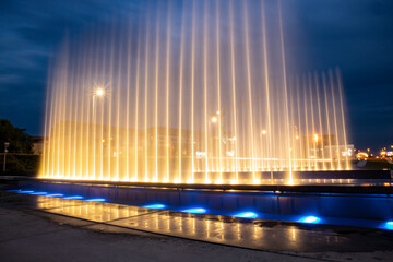Beautiful Zagreb city fountains  lit by lights at night, under dark, blue sky