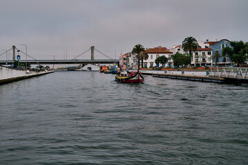 Traditional colorful boats in the canal of Aveiro
