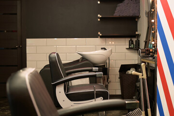 Empty chairs in a hairdresser, barbershop, beauty salon. Lack of clients