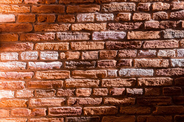 Sunny old brick wall background