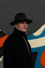 Portrait of young Mexican model wearing a hat