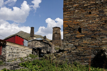 Medieval stone towers rise above the more recent homes of Ushguli village, Upper Svaneti, Georgia