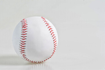 A single baseball isolated on white background. Selective focus points. Blurred background