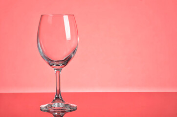 Empty wine glass laying with focus on the stem of the glass. Selective focus points. Blurred background