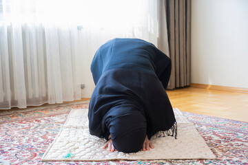 the young hijab muslim woman is praying. aid mubarak. ramadan 