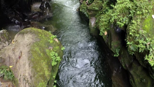 Las tinachas in Pastaza, the river called Anzu is going through a small canyon with two little cascades at the side