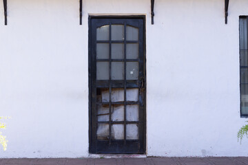 Old black door in an abandoned house.