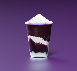Cup of Açaí with powdered milk and condensed milk on a purple background