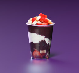 Cup of Açaí with strawberry and banana on a purple background