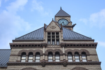 Fototapeta na wymiar Architectural fragments of Toronto's Old City Hall. Toronto's Old City Hall (1899) was home to its city council from 1899 to 1966 and remains one of city's most prominent structures. Ontario, Canada.