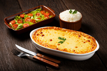 Shepherd's Pie (escondidinho) with salad and rice. Typical Brazilian food.