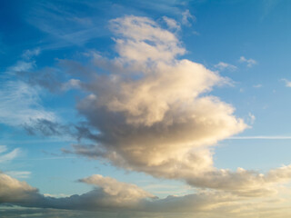 Dramatic white fluffy clouds on a blue sky. Nature background