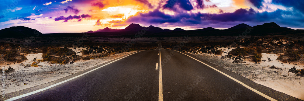 Canvas Prints image related to unexplored road journeys and adventures.road through the scenic landscape to the de