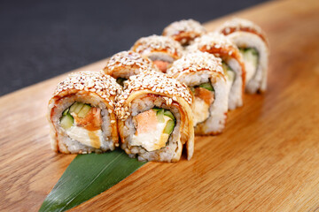 Eel unagi maki sushi rolls on serving board