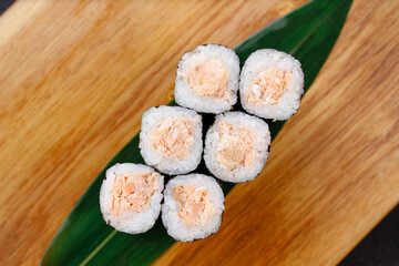 Seafood delicatessen maki sushi rolls on board