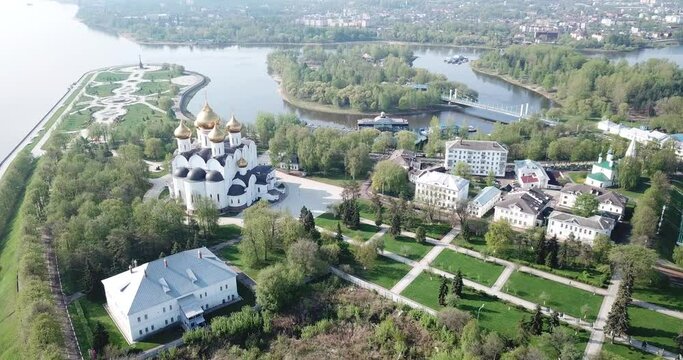 Aerial view of Assumption Cathedral on bank of Volga River and famous Strelka park in Russian city of Yaroslavl . High quality 4k footage