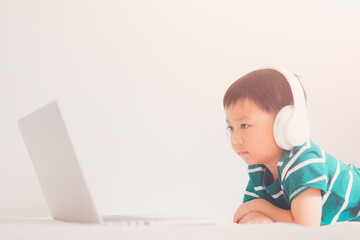 E-learning, online education at home.Online education.Distance learning, Asian kid child school boy online learning with laptop.Smart kid listen teacher talk.Success, programing, homeschool Student.